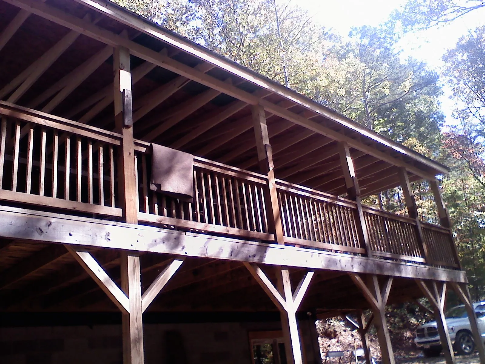 Timber framing under a new elevated porch and deck — Roof Leak Repair in Patriot by Roofing Brothers
